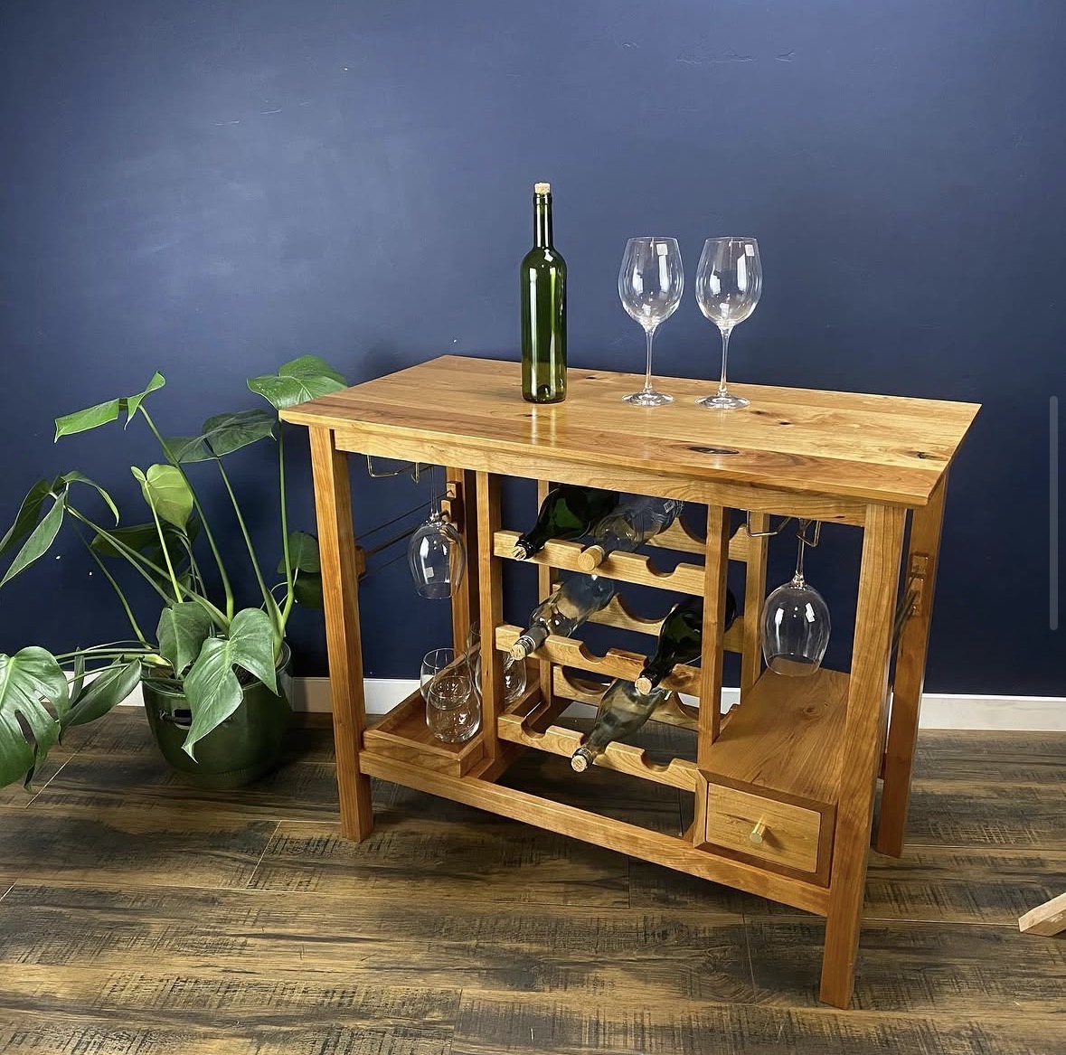 Handmade wood wine cabinet with bottle racks, glass storage and a drawer